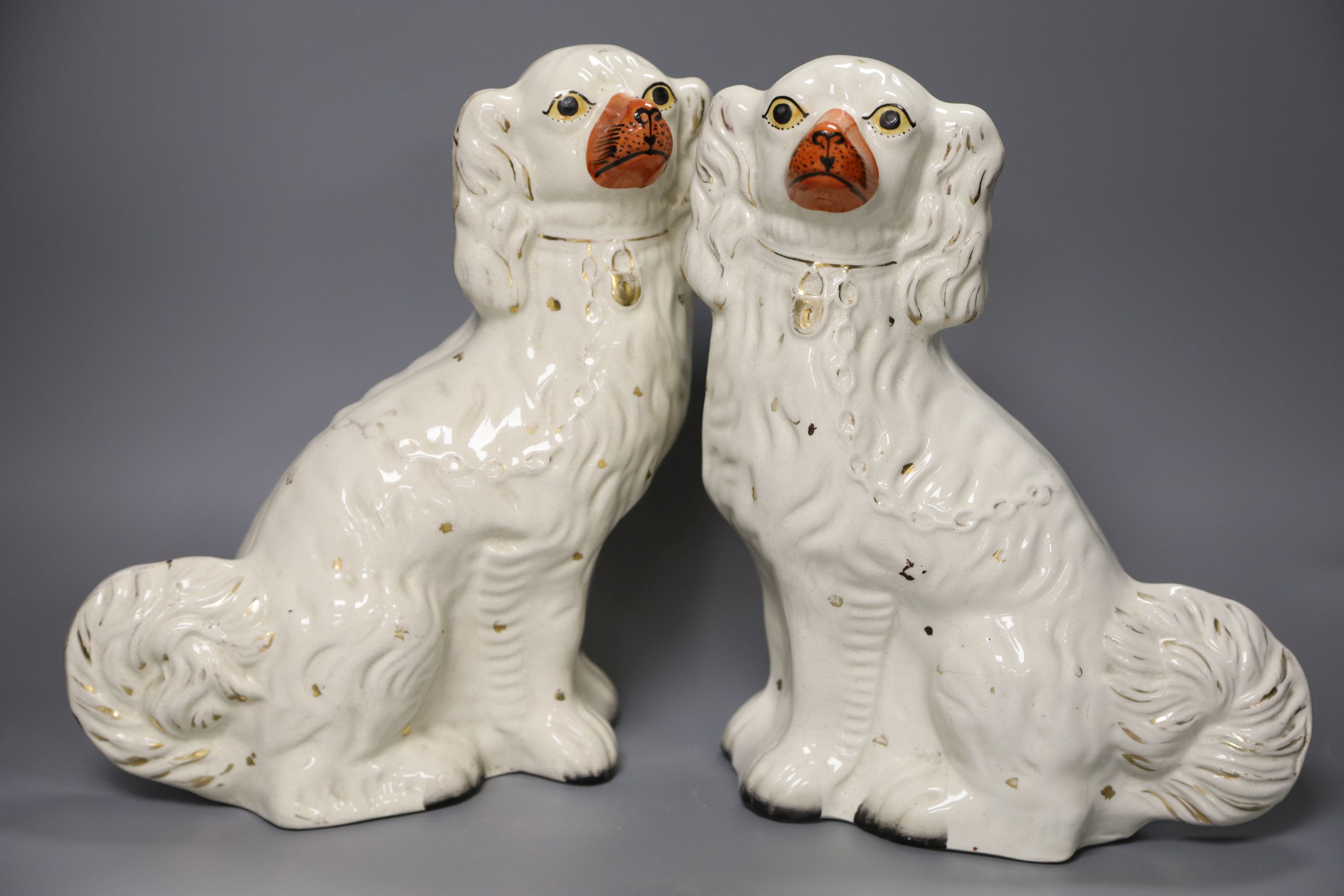 Two pairs of 19th century Staffordshire King Charles Spaniels, height 31cm